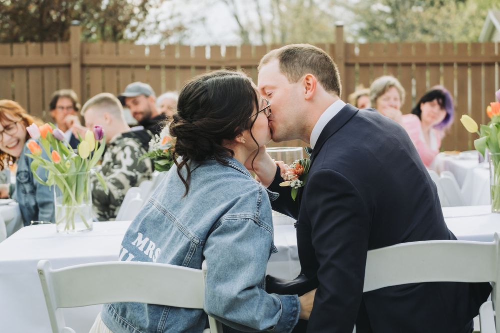 Bride and groom kissing at DIY backyard wedding in Kingston, Nova Scotia.