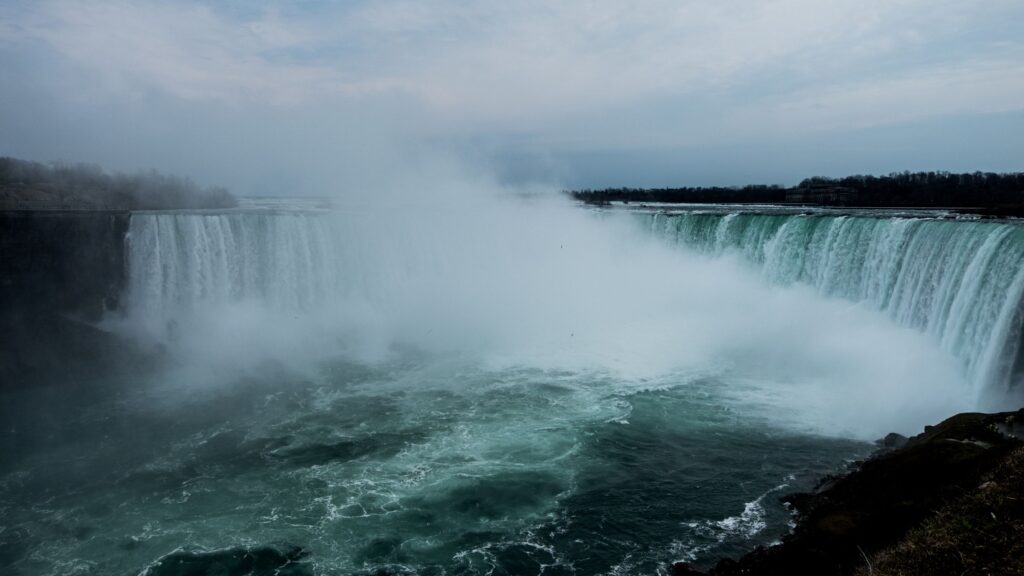 Niagara Falls on an overcast day with lots of mist.