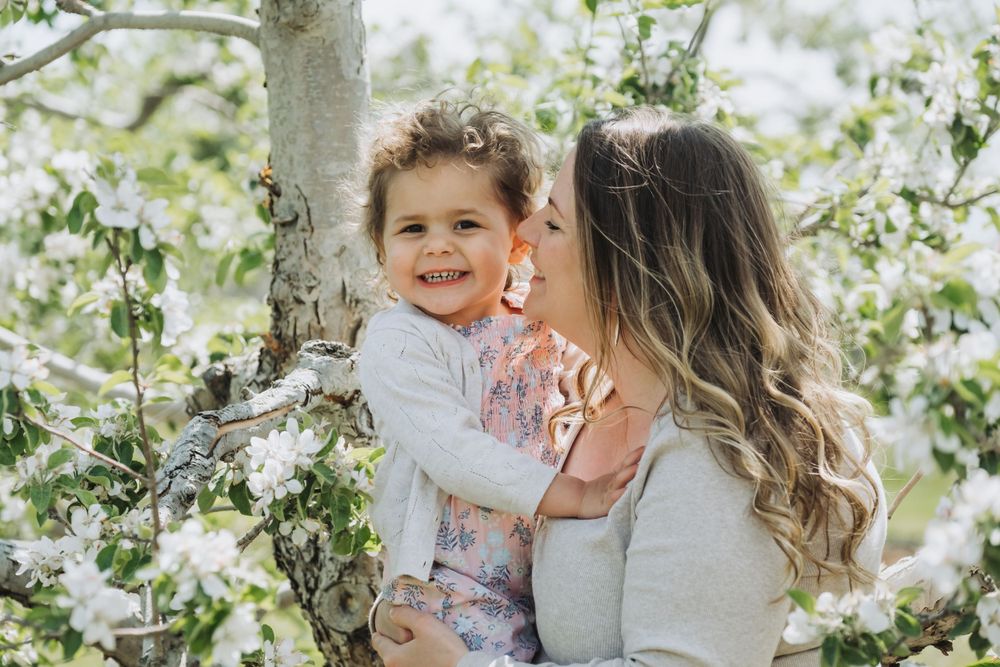 Mother holding child during family photo session in Annapolis Valley.