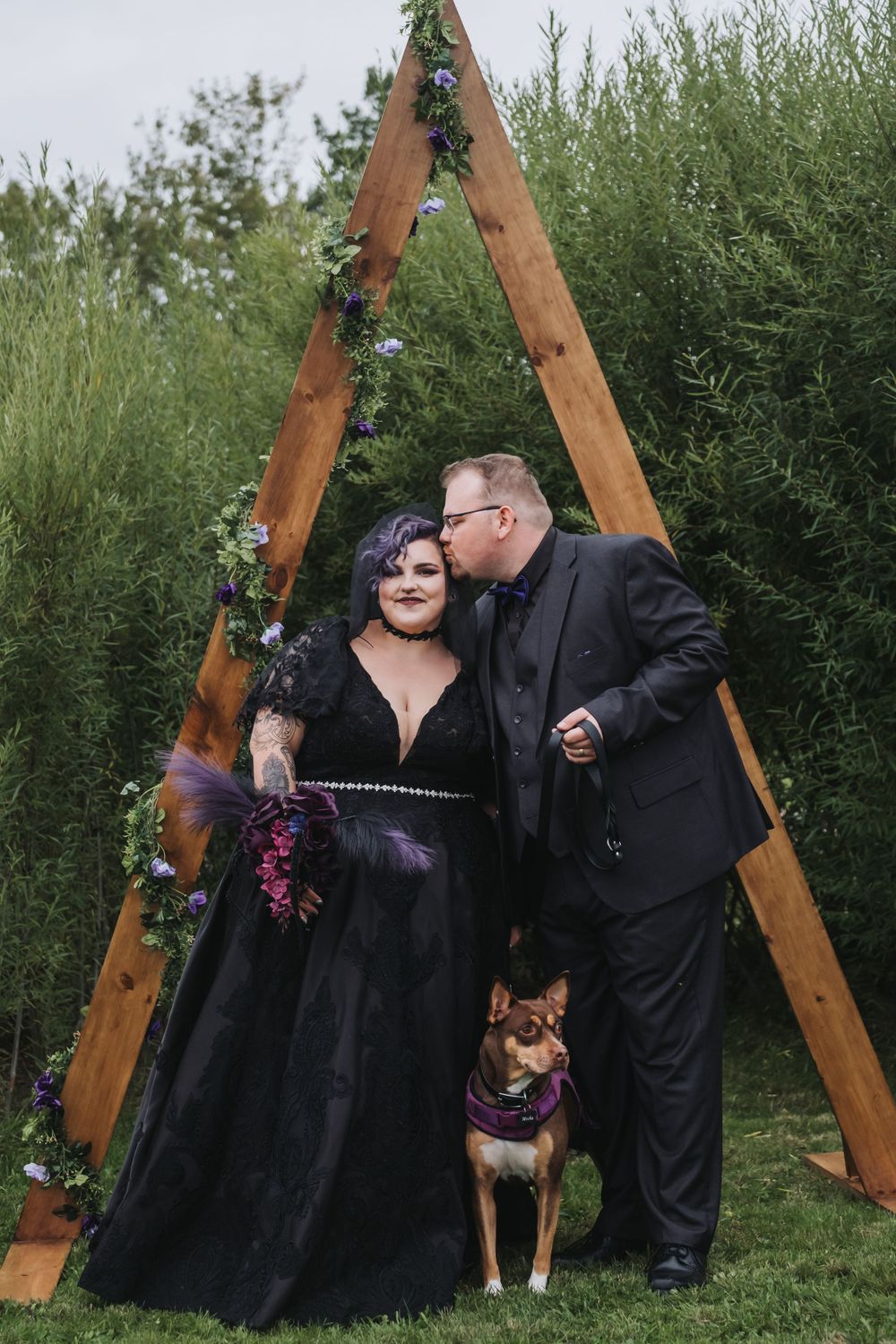 Non-traditional wedding couple and their dog during romantic October wedding in Nova Scotia.