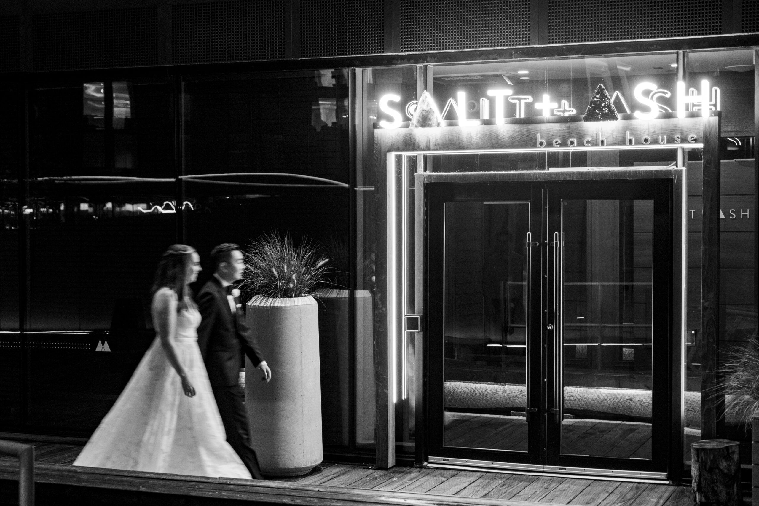 Bride and groom walking towards Salt and Ash in Halifax.